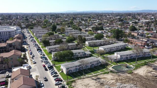 Afternoon aerial neighborhood view of historic public housing projects in Watts, California, USA.