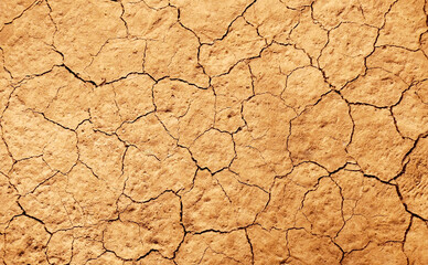 Cracked ground background in the top view for graphic design or wallpaper