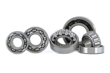 Group of various ball and roller bearings on white