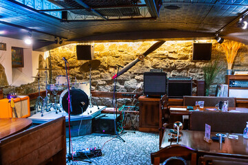 Interior of bar with a drum kit and an aircraft propeller