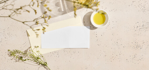 Realistic card on light background. Photo business envelope branding layout template, with concrete and floral elements for your design. Mockup paper envelope and empty blank for design.