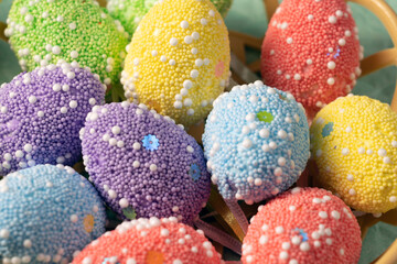 Decorative Easter eggs of different colors close-up