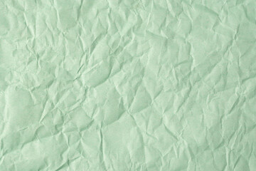 Recycled crumpled turquoise paper texture or paper background for design with copy space for text or image