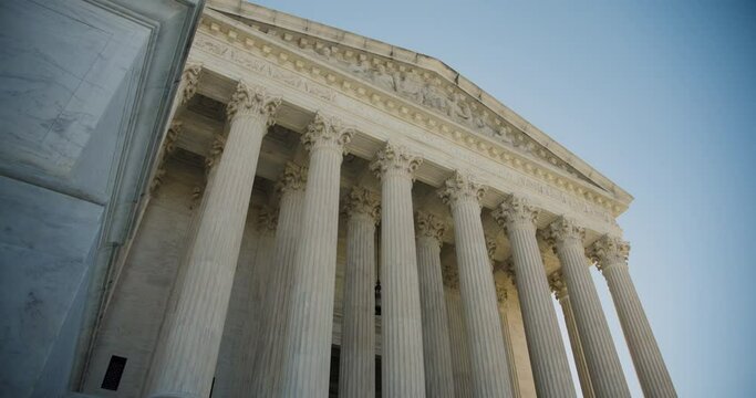 U.S. Supreme Court Exterior In Washington D.C. Early In The Morning With Blue Sky