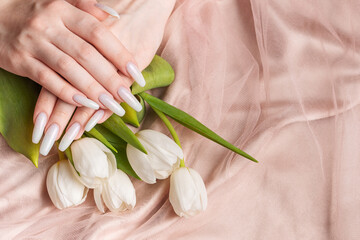 Female hand with spring nail design.