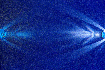 On a blue gradient fine-grained background, light blue scattered rays of light