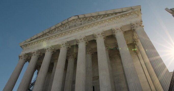 U.S. Supreme Court Exterior In Washington D.C. With Early Morning Sun Coming In At Frame Right
