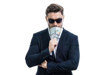 Man in suit holding cash money in dollar banknotes on isolated white background. Studio portrait of businessman with dollar banknotes. Dollar money. Career wealth business. Cash dollar concept.
