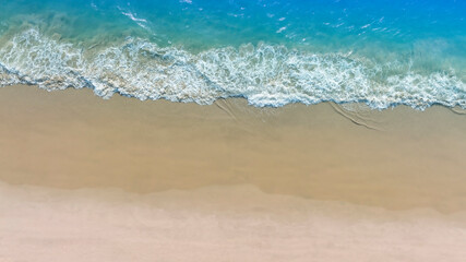 Aerial view with beach in wave of turquoise sea water shot, Top view of beautiful white sand background