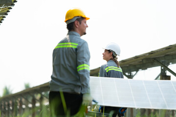 Engineering and technicians unloading repaired solar panels to be installed on the rows of solar cells lined up on hundreds of acres of grass