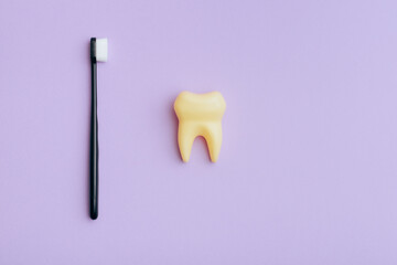 Toothbrush and Yellow Tooth in Dental Care Concept Image. Teeth whitening through good cleaning routine 
