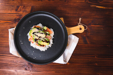 Sushi Waffles food trend, made with a crispy rice waffle and topped off with salmon, cucumber, and avocado. Flat lay