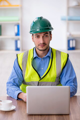 Young male architect working in the office