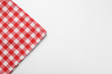 Fototapeta na wymiar Red checkered tablecloth on white background, top view