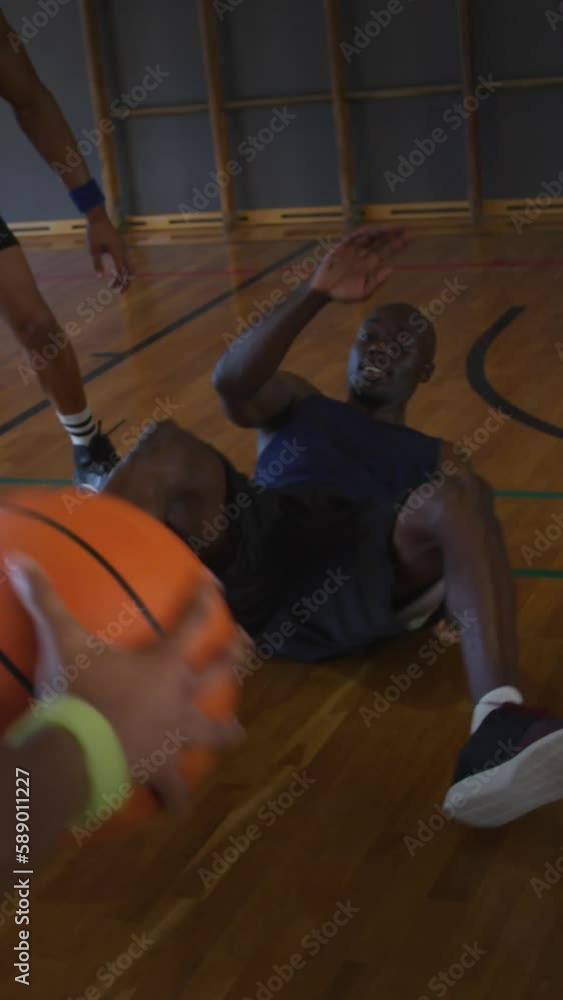 Canvas Prints Group of diverse team of male basketball players playing basketball in the court