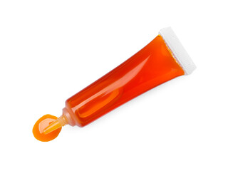 Tube with orange food coloring isolated on white, top view