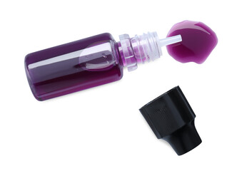 Bottle of purple food coloring on white background, top view