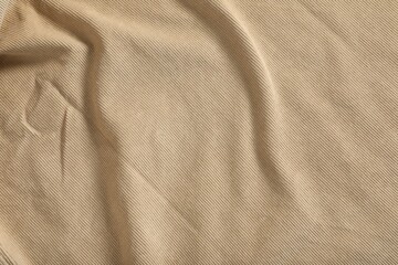 Crumpled beige fabric as background, top view