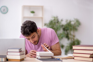 Young male student sitting in the classroom