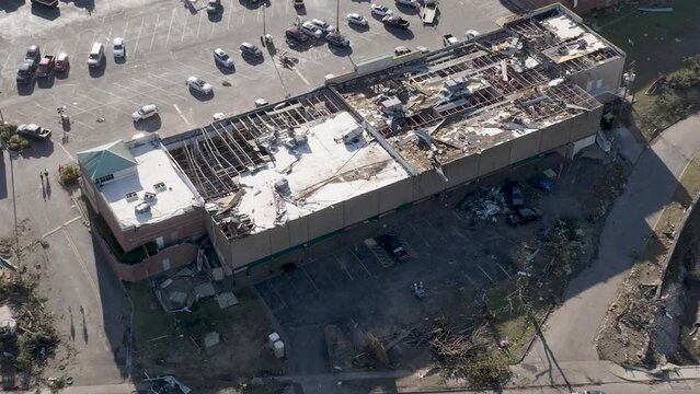 Strip mall in Little Rock, Arkansas damaged by tornado on March 31, 2023 with drone video above moving forward and tilting down.