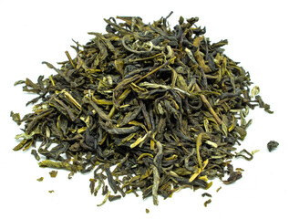 Herbal Green tea leaves piled on a white background with some leaves scattered around the edge of...