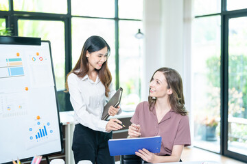 Fototapeta premium business woman using laptop or notebook computer with data analysis graph dashboard, confident woman working with computer laptop concept, contact idea design dashboard graph business conceptual.