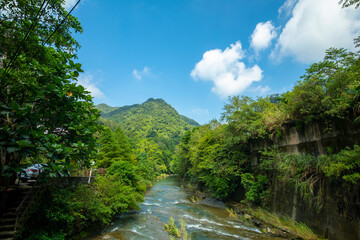 Valley, water flow, clean and cool, small stream, mountain, blue sky and white clouds
