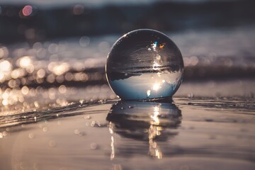 Abstract idea with water with an interesting effect. Glass ball on a blurred background on a...