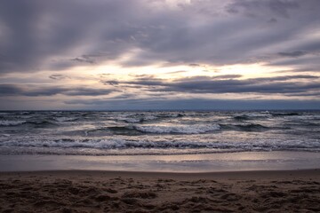 Fototapeta na wymiar Cloudy winter seaside landscape. Cloudy day on the beach in Gdynia, Poland.