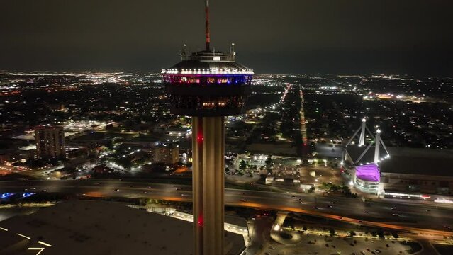 San Antonio, Texas Tower of the Americas at night with drone video circling around.