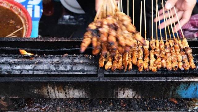 Sate Ayam (Chicken satay) with peanut sauce. One of the popular street food in Indonesia.
