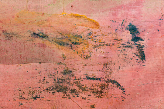 Marks and rust patterns on metal containers, close up.