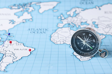 Traveling, adventure and vacation concept with compass