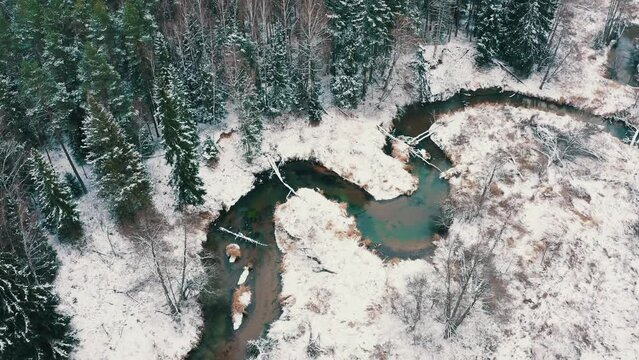 Wild trout river, in winter. Taken from a drone from above. forest winter landscape,