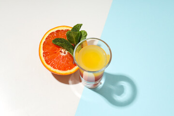 Shot with orange taste, tasty citrus shot concept