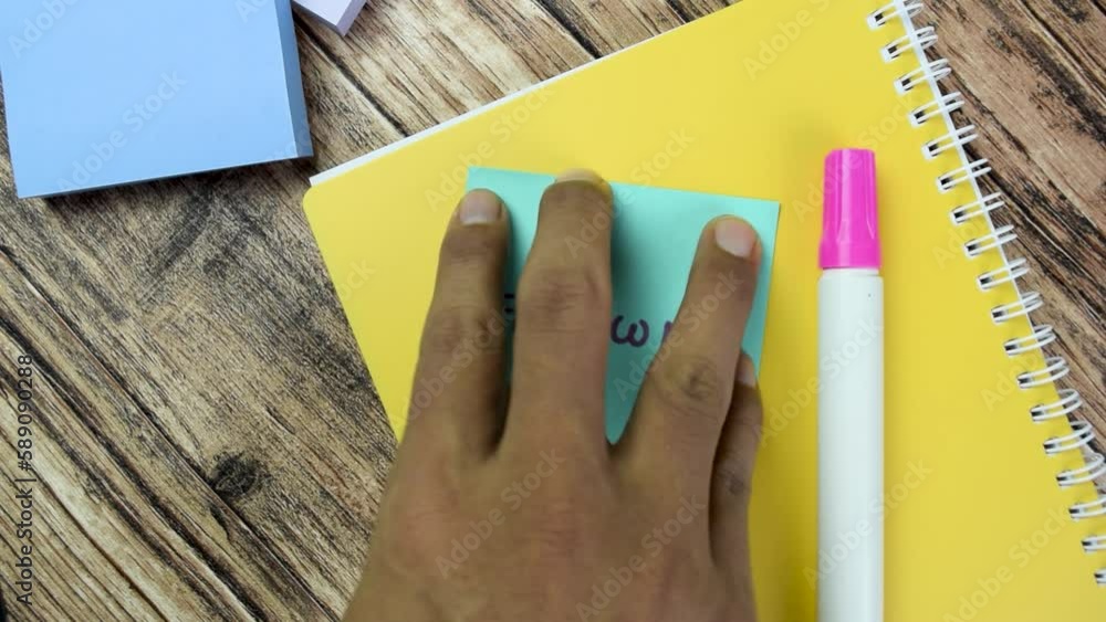 Poster concept of follow me! write on sticky notes isolated on wooden table.
