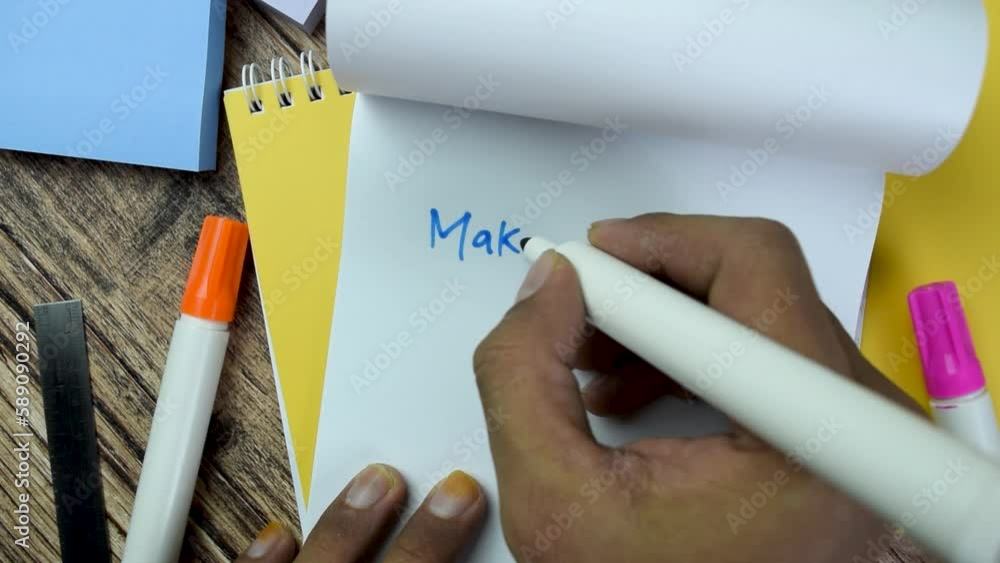 Poster concept of make it possible! write on book isolated on wooden table.