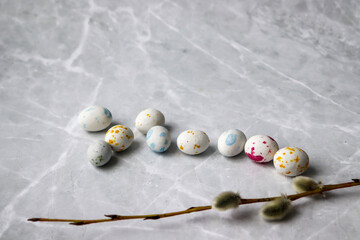 Small Easter eggs and willow on the table