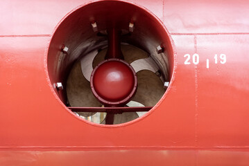 View on the stern thruster propeller of the big container ship. Ship is in the dry dock for...