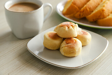 Bakpia cake typical of Yogyakarta with various kinds of fillings served on a plate with tea, coffee and other cakes