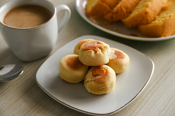 Bakpia cake typical of Yogyakarta with various kinds of fillings served on a plate with tea, coffee and other cakes