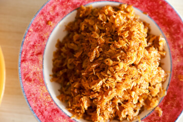 fried ebi (teri medan) or dried baby prawns served as a side dish on a plate