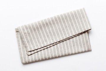top view with gray kitchen napkin isolated on table background. Folded cloth for mockup with copy...