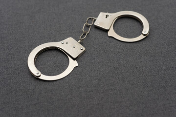 Closed metal handcuffs Crime concept