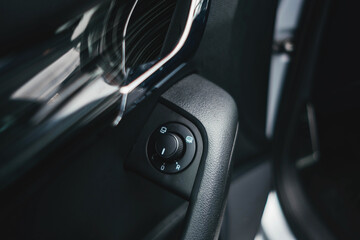 Obraz na płótnie Canvas Modern black car interior, black car doors with window control buttons, details interior. 