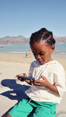 black African boy using a cellphone
