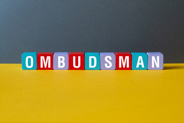 Ombudsman - word concept on cubes