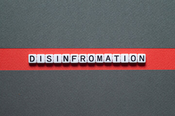 Disinformation - word concept on cubes