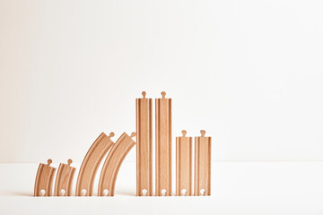 The large family concept: two childrens, parents, grandmother, grandfather, great-grandparents, sister and brother, twins, foster child. Wooden eco friendly toy railroad. Genus lifetime. Aging nation