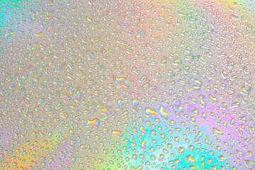 Blurred defocused abstract iridescent foil wallpaper texture. Holographic soft pastel colors backdrop. Colorful rainbow gradient poster, banner background. Minimal liquid owerflow